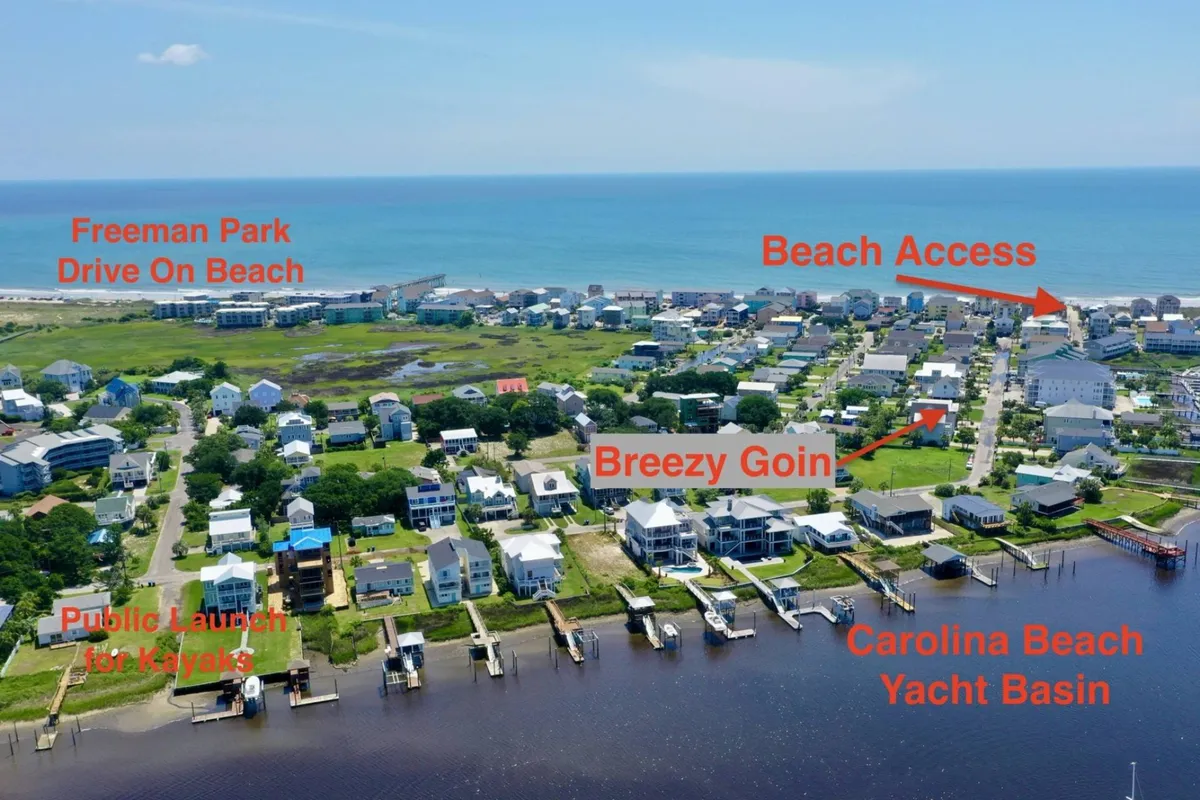 A sweeping aerial view showcasing Freeman Park’s drive-on beach, the nearby Breezy Goin property, and the Carolina Beach Yacht Basin. The layout highlights the proximity of adventurous activities like 4WD beach access, kayaking, and water sports, all set within a vibrant local landscape.